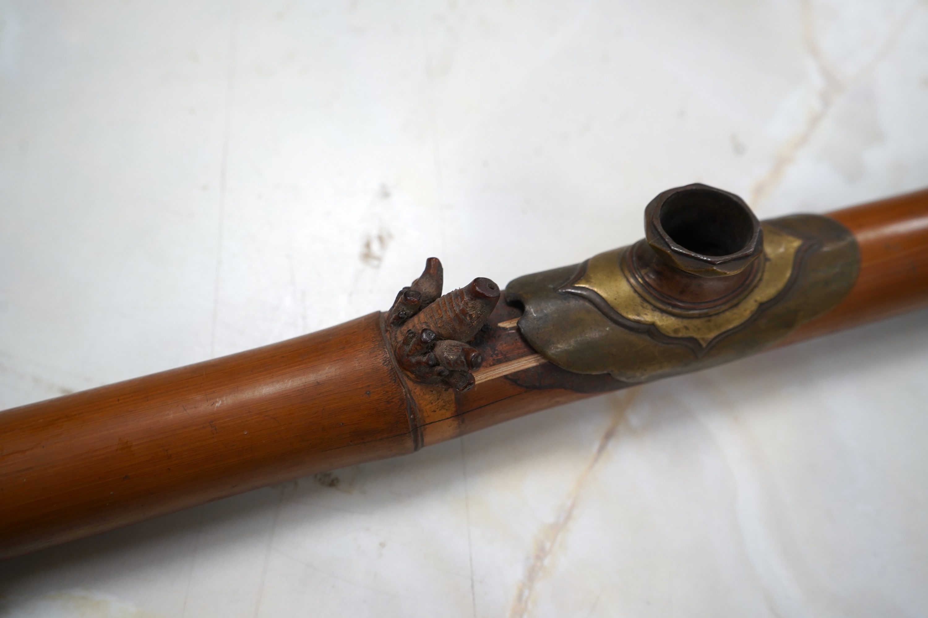 A 19th century bamboo and ivory mounted opium pipe, 58cm in length CITES Submission reference 7T1VK7KR